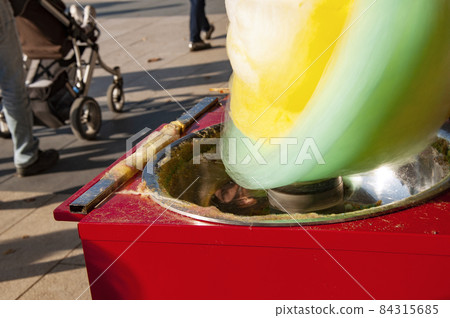 red cotton candy machine in a park closeup high quality photo 84315685