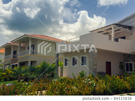 Beautiful Luxurious villa with an own swimming pool in Dominican Republic. summer residence on luxury Caribbean resort and beautiful garden. 84315816