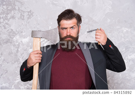 Long beard is style for him. Bearded man hold razor Long beard is style for him. Bearded man hold razor 84315892