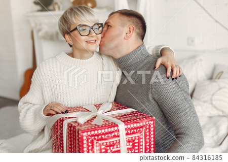 People in a winter clothes in a christmass atmosphere 84316185