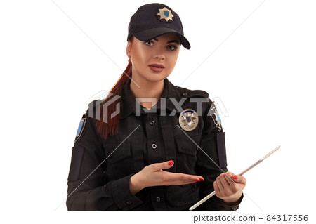 Close-up portrait of a female police officer is posing for the camera isolated on white background. Close-up portrait of a female police officer is posing for the camera isolated on white background. 84317556