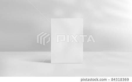White book with sun flare effect. Light of the window with reflections on the wall and on the floor White book with sun flare effect. Light of the window with reflections on the wall and on the floor 84318369