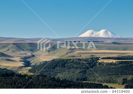Big snowy mountain Elbrus beautiful nature landscape, Long distance view. 84319400