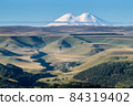 Mountain Elbrus with snowy peaks beautiful nature landscape, View at long distance. 84319402