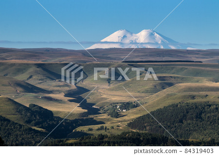 Big snowy mountain Elbrus beautiful nature landscape, Long distance view. 84319403