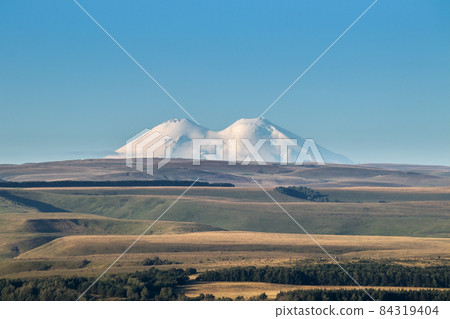 Snowy mountain Elbrus beautiful nature landscape, Long distance view. 84319404