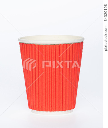 Photo of a disposable red paper cup on a white background. Empty paper coffee cup. Photo of a disposable red paper cup on a white background. Empty paper coffee cup. 84320198