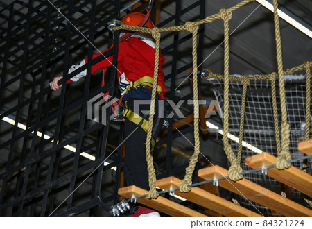 Active attraction kids move in the rope park Active attraction kids move in the rope park 84321224