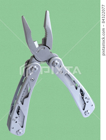 Miniature, pocket-sized universal Multi tool containing  knife, opener, pliers, scissors and a file. 84322077