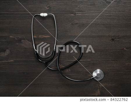 Stethoscope on wood table 84322762
