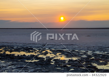 Pink salty Siwash Lake at sunset 84322920