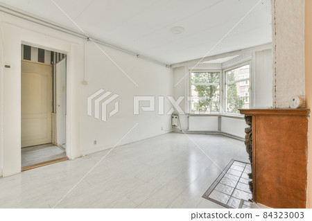 Interior of a spacious bright room with a fireplace Interior of a spacious bright room with a fireplace 84323003
