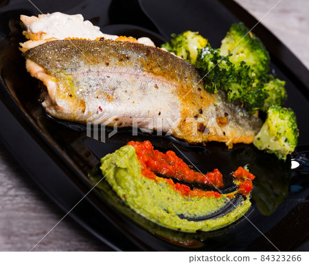 Grilled trout with broccoli and tartar 84323266
