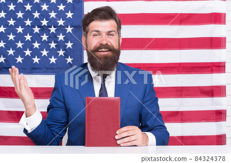 Student visa. Visa applicant hold book on american flag Student visa. Visa applicant hold book on american flag 84324378