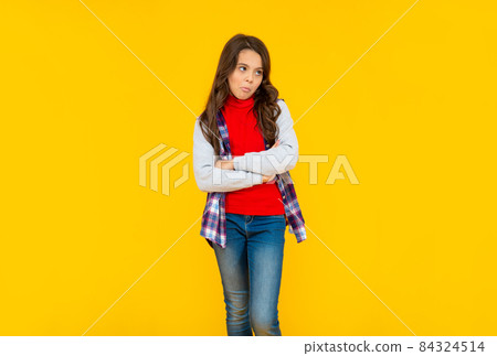 childhood. child express emotions. upset teen girl has long curly hair. back to school. childhood. child express emotions. upset teen girl has long curly hair. back to school. 84324514
