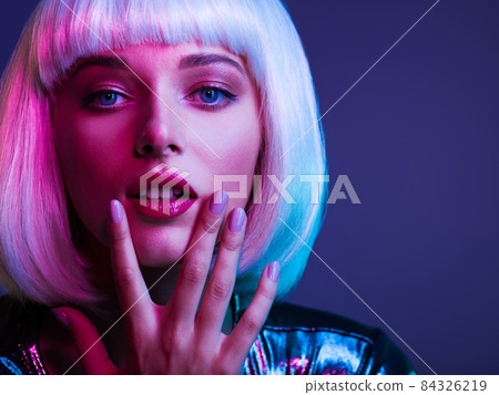 Glamour fashion girl. Beauty face with bright makeup. Young beautiful woman in a white wig, bob hairstyle. Close up art portrait of an young attractive woman with vivid colors. Stylish blonde. Glamour fashion girl. Beauty face with bright makeup. Young beautiful woman in a white wig, bob hairstyle. Close up art portrait of an young attractive woman with vivid colors. Stylish blonde. 84326219