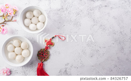 Tang Yuan(sweet dumplings balls), a traditional cuisine for Mid-autumn, Dongzhi (winter solstice ) and Chinese new year. Chinese characters FU in the article refer to fortune, wealth, money flow. Tang Yuan(sweet dumplings balls), a traditional cuisine for Mid-autumn, Dongzhi (winter solstice ) and Chinese new year. Chinese characters FU in the article refer to fortune, wealth, money flow. 84326757