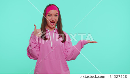Girl pointing empty place, advertising area for commercial text, copy space for goods promotion 84327328