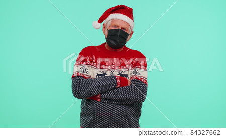 Senior Christmas grandfather wearing face mask ppe to safe from coronavirus on lockdown quarantine Senior Christmas grandfather wearing face mask ppe to safe from coronavirus on lockdown quarantine 84327662