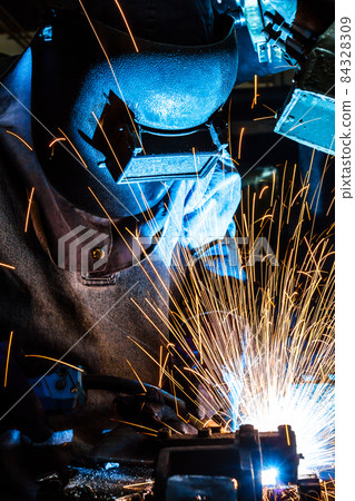 Industrial steel welder in factory 84328309