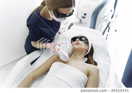 Woman in cosmetology studio on laser hair removal 84329141