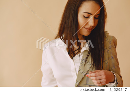 Fashion girl posing in a photo studio 84329247