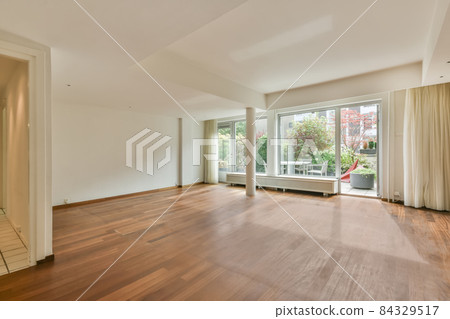 Huge room with wooden floor and columns Huge room with wooden floor and columns 84329517