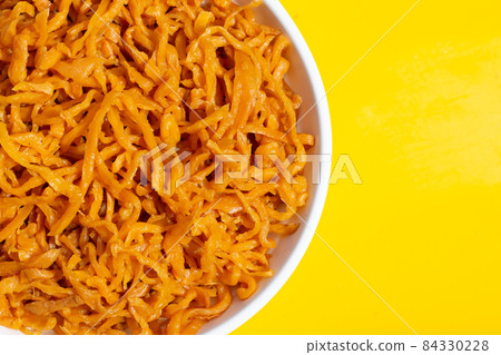 Pickle Turnip in plate on yellow background. 84330228
