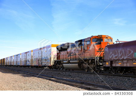 A long-distance freight train that runs along Route 66 across the Americas A long-distance freight train that runs along Route 66 across the Americas 84330308