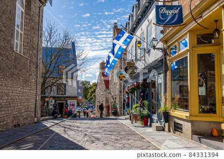 Quebec, Canada - October 20 2021 : Quebec City Old Town street view in autumn season. Place Royale. Rue Notre-Dame. 84331394