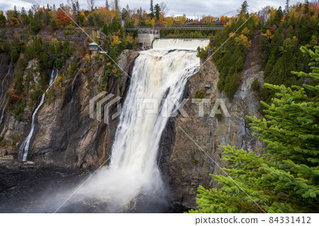 Montmorency Falls in the fall season. Quebec, Canada. Montmorency Falls in the fall season. Quebec, Canada. 84331412
