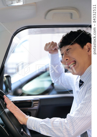 Image of a businessman driving dangerously Image of a businessman driving dangerously 84332511
