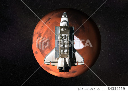 Flying space shuttle close to the Mars planet of Solar system. Flying space shuttle close to the Mars planet of Solar system. 84334239