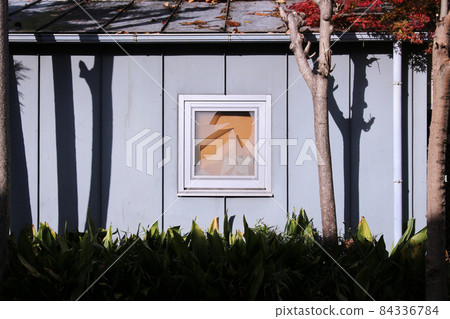 Repair with a board from the broken window glass of a Scandinavian house 84336784