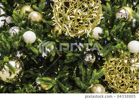 decorated Christmas tree with the balls and lights decorated Christmas tree with the balls and lights 84338805