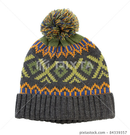 Winter hat with a balabon of dark green color isolated in white. Men's clothing. Winter hat with a balabon of dark green color isolated in white. Men's clothing. 84339357
