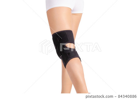Knee Support Brace on leg isolated on white background. Orthopedic Anatomic. Braces for knee fixation, injuries and pain. Knee Joint Bandage Sleeve. Elastic Sports. 84340886