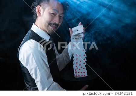 A full-fledged magician performing on stage A full-fledged magician performing on stage 84342181