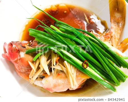 Steamed red grouper in Chinese style 84342941