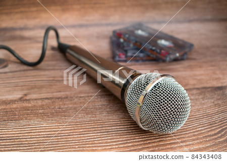 Sound microphone and old audio cassettes with music Sound microphone and old audio cassettes with music 84343408