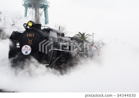C62 type steam locomotive going through white smoke C62 type steam locomotive going through white smoke 84344830