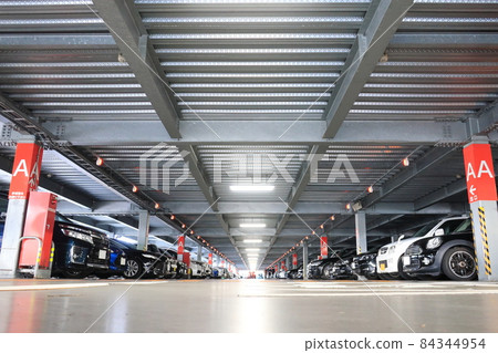 A multi-storey parking lot with vehicle detection sensors that allows you to see the parking status A multi-storey parking lot with vehicle detection sensors that allows you to see the parking status 84344954