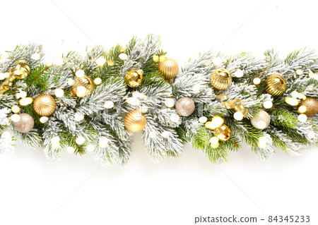 Christmas banner with gold baubles in row on snowy evergreen branches. 84345233