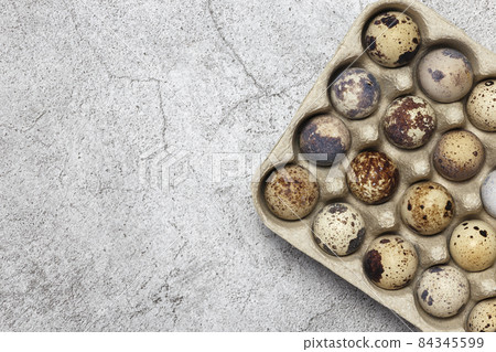 Food background of quail eggs close-up containing vitamin A, B, PP, B12, amino acids, beta-carotene, calcium, magnesium, iron, phosphorus, protein, choline, riboflavin, folic acid, selenium Food background of quail eggs close-up containing vitamin A, B, PP, B12, amino acids, beta-carotene, calcium, magnesium, iron, phosphorus, protein, choline, riboflavin, folic acid, selenium 84345599