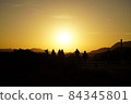 Silhouettes of people watching the sunset from the Griffith Observatory 84345801