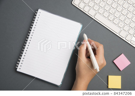 Keyboard Over A Table Beside A Notebook And Pens With Sticky Notes. Computer Keypad On Top Of A Desk With A Office Supplies And Desk Photo.. Keyboard Over A Table Beside A Notebook And Pens With Sticky Notes. Computer Keypad On Top Of A Desk With A Office Supplies And Desk Photo.. 84347206