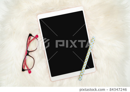 Office Supplies Over Desk With Keyboard And Glasses And Coffee Cup For Working Remotely, Assorted School Utilities For Studying With Hot Drink And Eyeglasses. 84347246