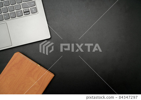 Office Supplies Over Desk With Keyboard And Glasses And Coffee Cup For Working Remotely, Assorted School Utilities For Studying With Hot Drink And Eyeglasses. 84347297