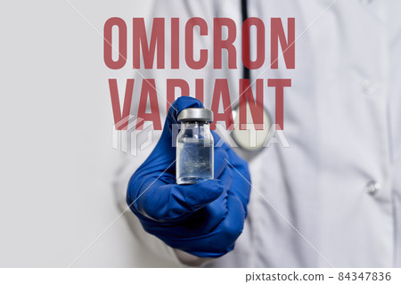 A doctor holds vaccine against new covid-19 omicron variant. New generation vaccine against Coronavirus South African variant. Omicron variant of SARS-CoV-2. New B.1.1.529 Variant of concern A doctor holds vaccine against new covid-19 omicron variant. New generation vaccine against Coronavirus South African variant. Omicron variant of SARS-CoV-2. New B.1.1.529 Variant of concern 84347836