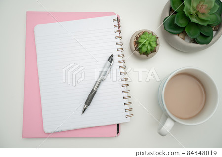 Office Supplies Over Desk With Keyboard And Glasses And Coffee Cup For Working Remotely, Assorted School Utilities For Studying With Hot Drink And Eyeglasses. 84348019